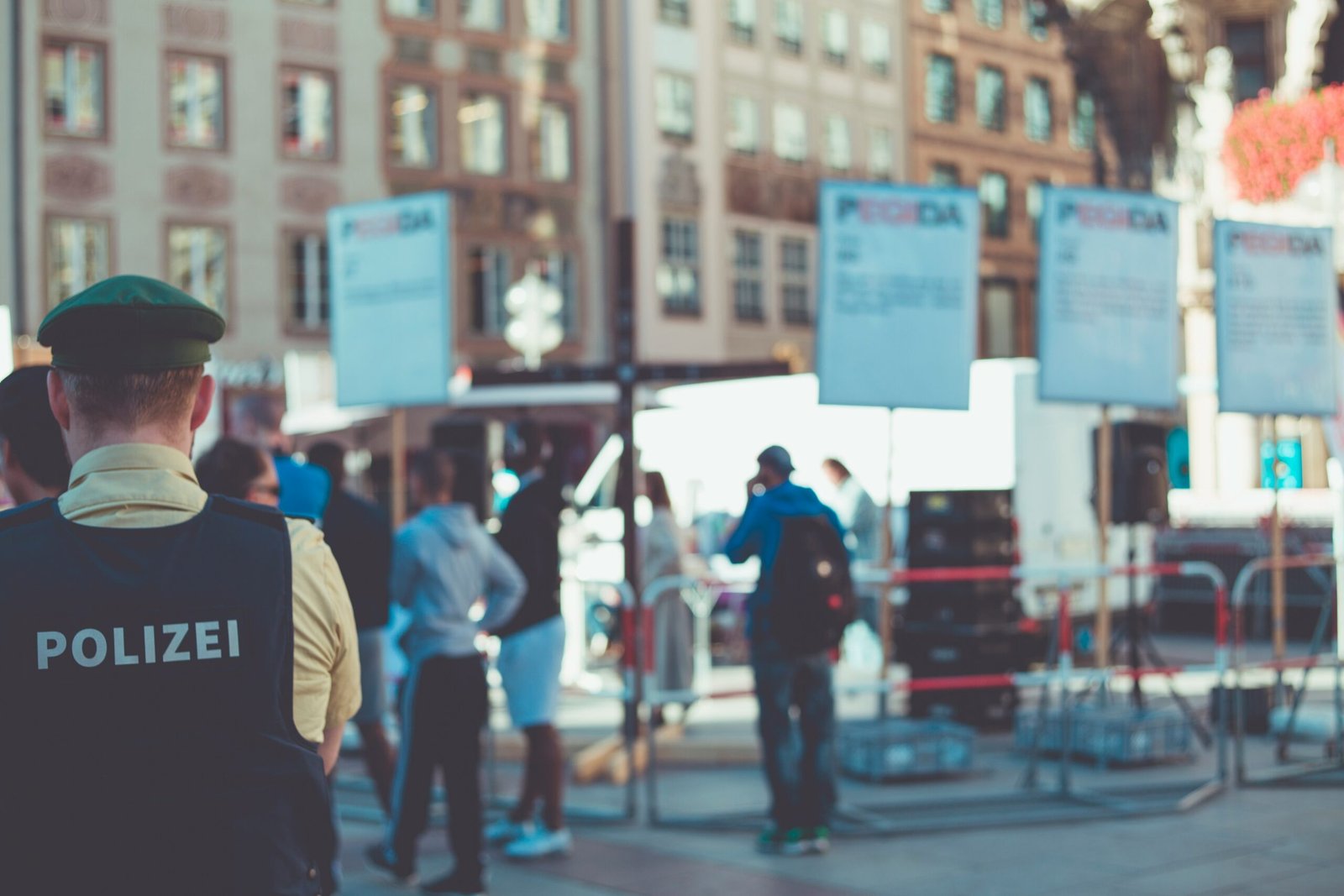 people walking on road near buildings